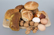 gem, nuts and eggs on a wooden board