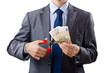 Man cutting money on white