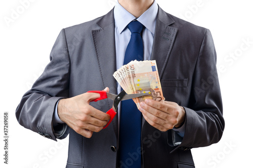 Photo: Man cutting money on white Man cutting money on white
