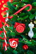 Noble Pine Christmas Tree Decorated With Candy Cands And Ornamen