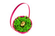 golden egg nestled in a pink easter basket