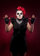 Photo: funny woman in day of the dead mask smile on red funny woman in day of the dead mask smile on red