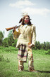 Photo: North American Indian in full dress. Reconstruction North American Indian in full dress. Reconstruction