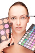 Woman with professional makeup and palette eyeshadow