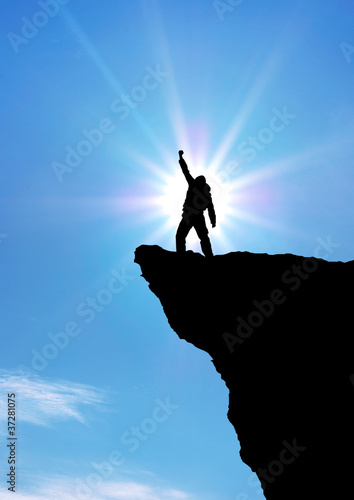 Photo: Man on top of mountain. Man on top of mountain.