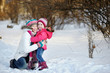 Young mother and her daughter at winter day Young mother and her daughter at winter day