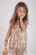 Little cute girl with long hairs, holding flower