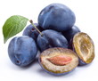 Group of plums with leaf.