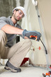 Electrician working on electrics