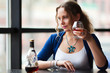 Young woman with a cognac