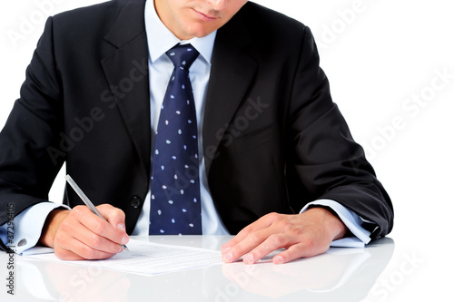 Photo: Businessman holding a pen Businessman holding a pen