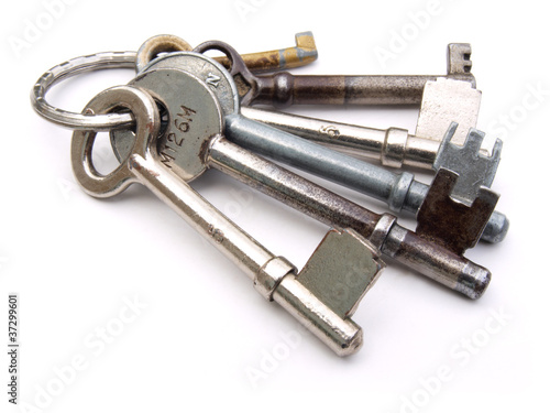 Photo: Set of keys on a ring on a white background Set of keys on a ring on a white background