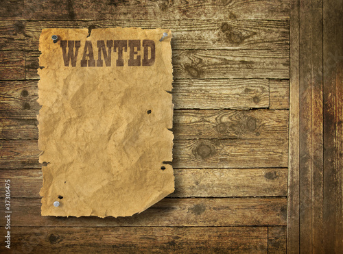 Photo: Wild West wanted poster on old wooden wall Wild West wanted poster on old wooden wall