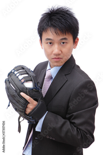 Photo: Young Business Man pitching baseball Young Business Man pitching baseball