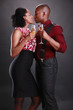 An african american couple cheers with champagne flutes An african american couple cheers with champagne flutes
