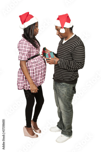 Photo: Black Couple Opening a Christmas or birthday present Black Couple Opening a Christmas or birthday present