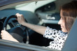 woman is driving her car