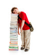 Student standing close to pile of books on white background