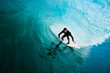 Surfer on Blue Ocean Wave in the Tube Getting Barreled