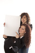 Young women holding billboard