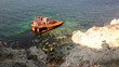 The rusty rests of the ship in the sea near coast