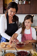 Mother and daughter baking at home Mother and daughter baking at home