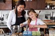 Mother and daughter baking at home
