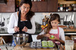 Mother and daughter baking at home Mother and daughter baking at home
