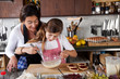 Mother and daughter baking at home Mother and daughter baking at home