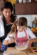 Mother and daughter baking at home Mother and daughter baking at home