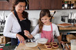 Mother and daughter baking at home Mother and daughter baking at home