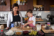 Mother and daughter baking at home Mother and daughter baking at home