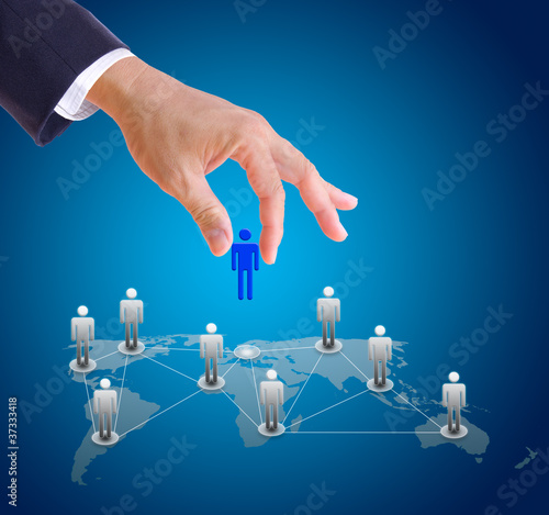 Photo: business man hand choosing people from social network business man hand choosing people from social network