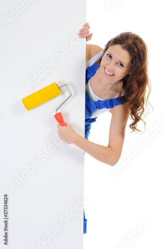 Photo: Beautiful young woman doing repairs Beautiful young woman doing repairs