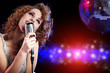Portrait of a glamorous girl with mike singing song Portrait of a glamorous girl with mike singing song