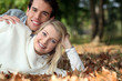 Young couple lying on the grass together