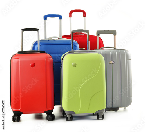 Photo: Luggage consisting of polycarbonate suitcases isolated on white Luggage consisting of polycarbonate suitcases isolated on white
