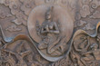 An ancient mural wood carving from Thailand.