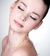 Photo : Face of woman with water drops on the face Face of woman with water drops on the face