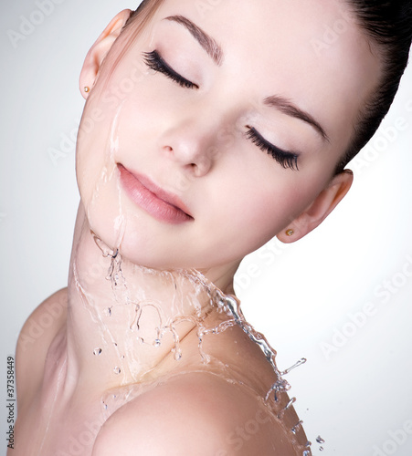 Photo: Face of woman with water drops on the face Face of woman with water drops on the face