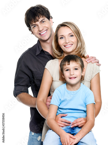 Photo: Happy young family with child - isolated Happy young family with child - isolated