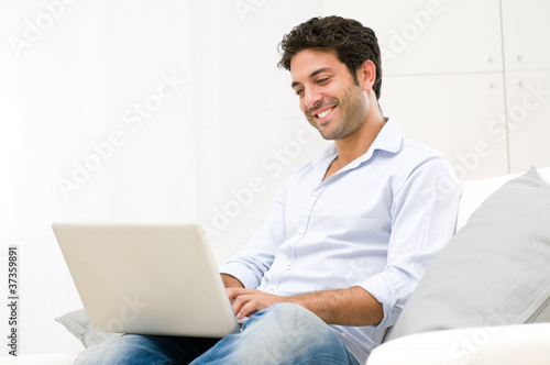 Photo: Young man at laptop Young man at laptop