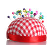 Colored pinheads in pin-cushion isolated on white
