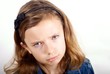 Girl looking sad against white background
