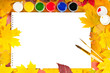 album with paints and brushes in a frame of leaves album with paints and brushes in a frame of leaves