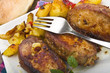Roasted chicken with potatoes in the white plate Roasted chicken with potatoes in the white plate