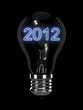 Photo : New Year 2012 light bulb. Isolated on the black background