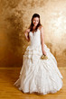 Beautiful dark haired woman in white bridal dress