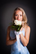 Beautiful blonde haired woman in blue bridal dress