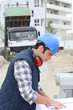 Construction worker looking at plans